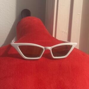 White glasses with green lenses